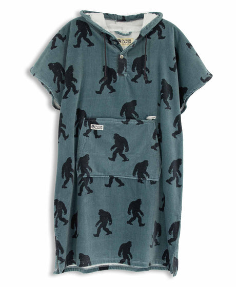 Blue towel poncho with black Sasquatch pattern on a white background