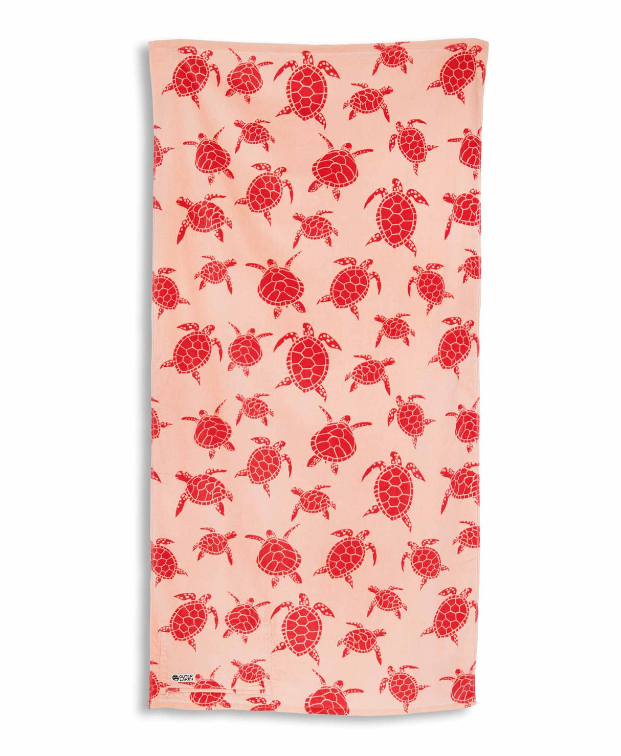 Beach towel with pink turtle pattern on a white background