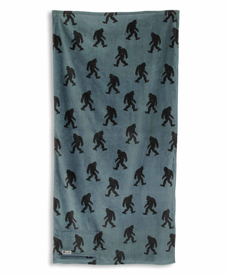 Blue towel with black Sasquatch pattern on a white background