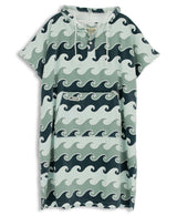 Blue towel poncho with wave pattern on a white background
