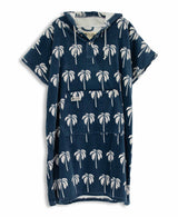 Navy blue towel poncho with white palm tree pattern on a white background