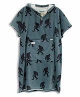 Blue towel poncho with black Sasquatch pattern on a white background