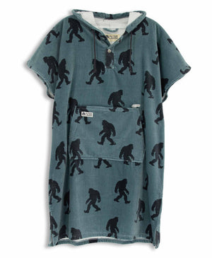 Blue towel poncho with black Sasquatch pattern on a white background
