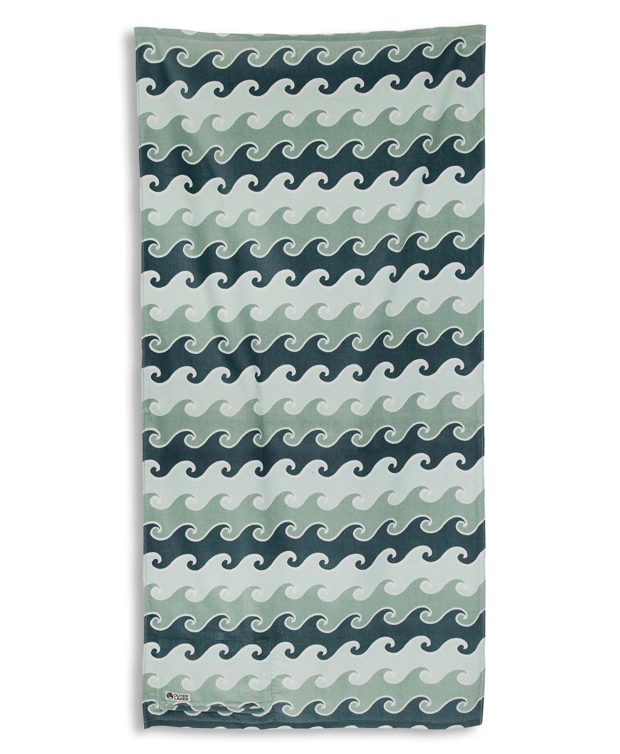 Towel with wave pattern in blue and green on a white background