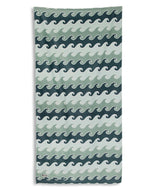 Towel with wave pattern in blue and green on a white background