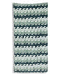 Towel with wave pattern in blue and green on a white background