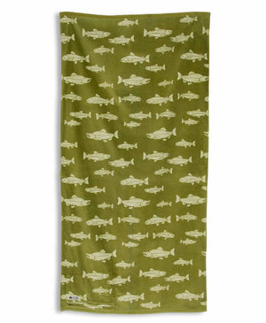 Towel with green fish pattern on a white background