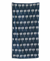 Navy blue towel with white palm tree pattern on a white background