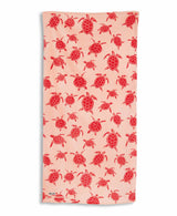 Beach towel with pink turtle pattern on a white background