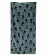 Blue towel with black Sasquatch pattern on a white background